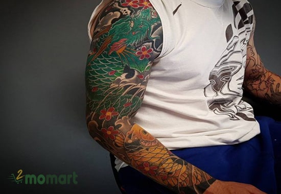 Tattoo cá chép hóa rồng full tay là biểu tượng cho sự may mắn